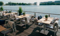 Tables set on Deck 4 Terrace at the Hotel Vier Jahreszeiten on the Inner Alster