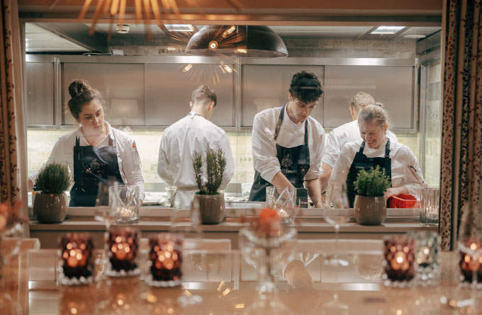 A shot of the kitchen at Restaurant Haerlin*** whilst several chefs are at work.