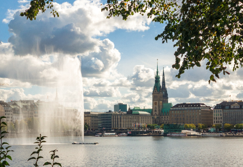 View of Hamburg's Alster promenade from the Alster Lake in fine weather
